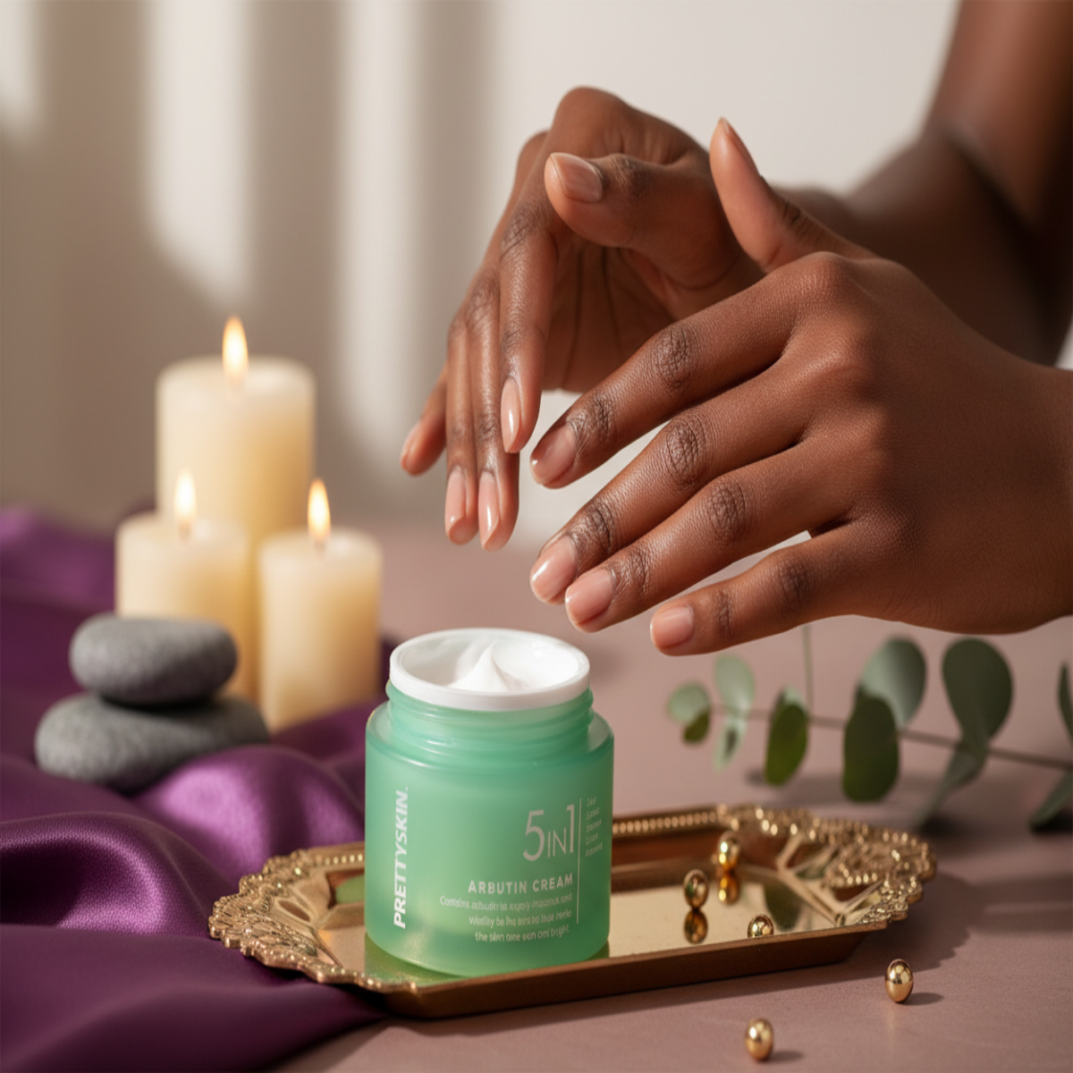 Close-up of hands applying 5 In 1 Arbutin Cream with purple and gold spa accents